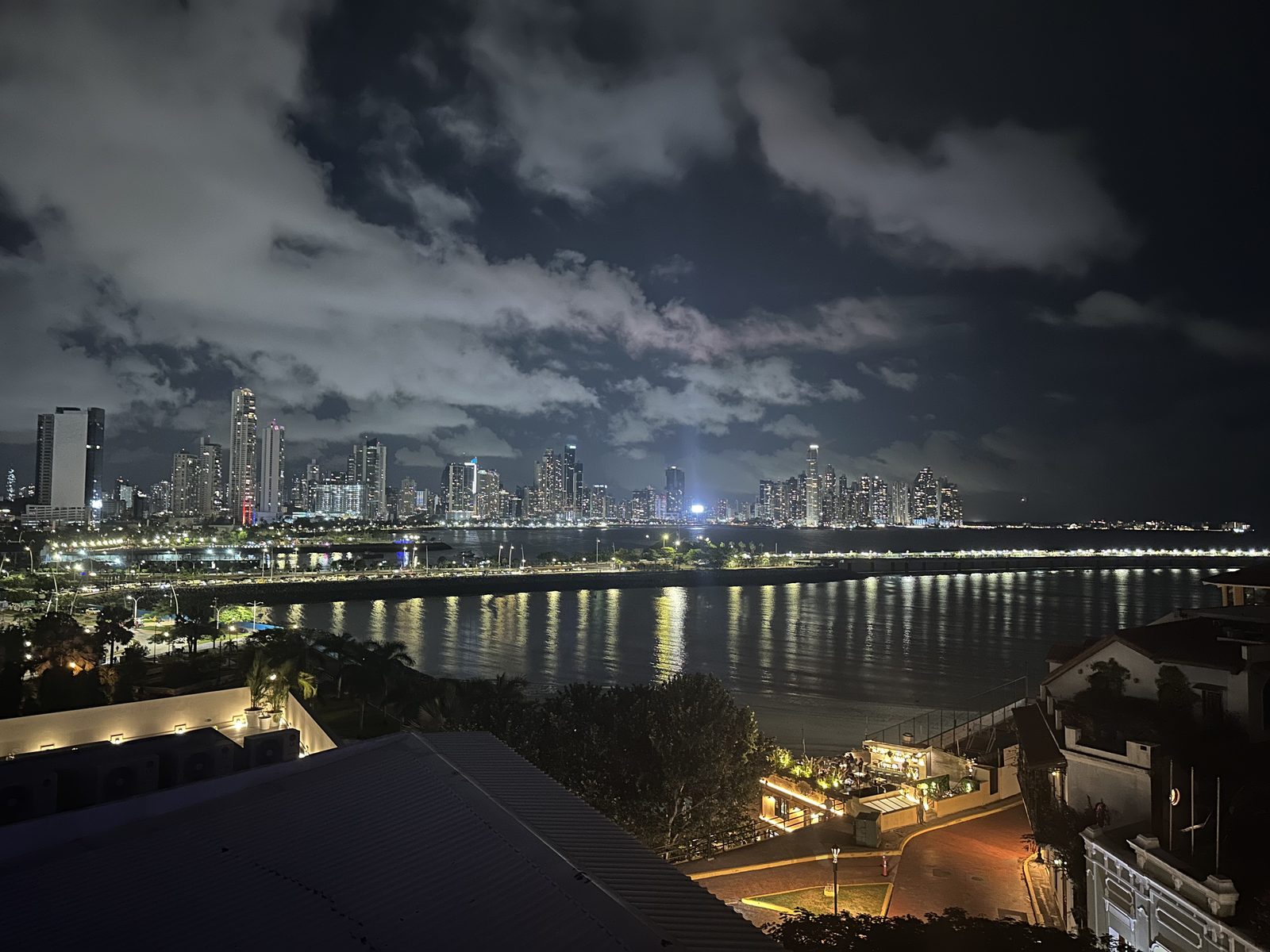 The Panama City skyline lit up at night across the water